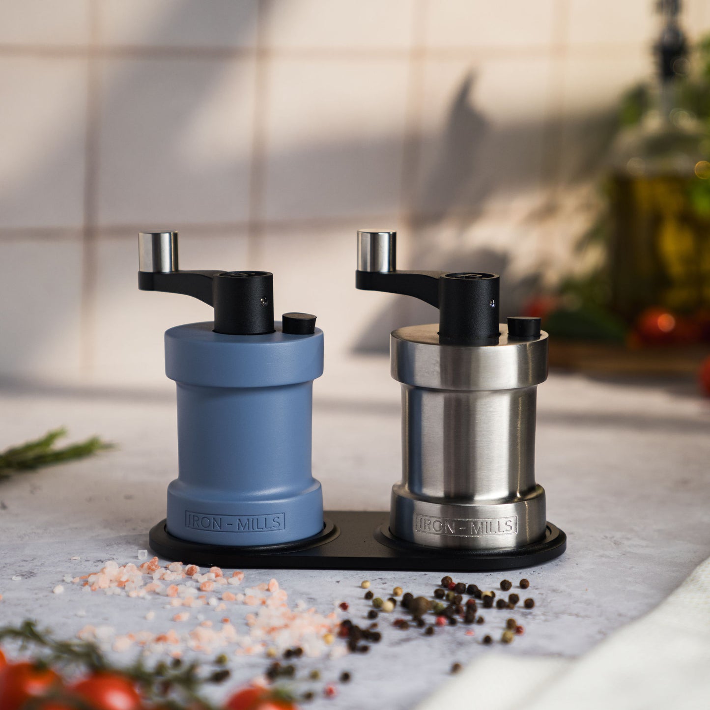 Iron-Mills pigeon blue and brushed stainless steel salt and pepper mills on a stylish mill base for a clean, modern look