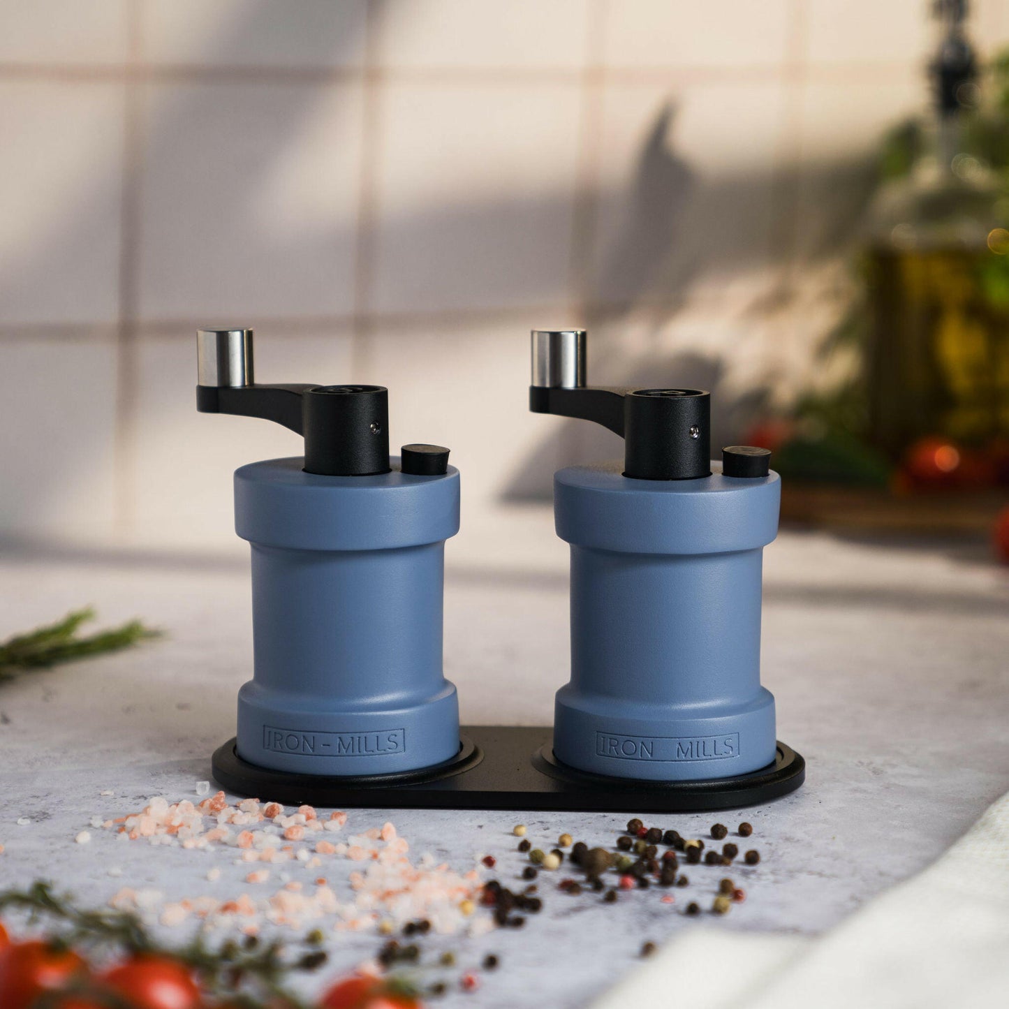 Iron-Mills pigeon blue salt and pepper mills resting together showcasing their soft and sophisticated look